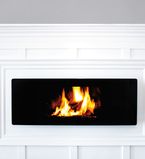 White moulding around the fireplace with a light grey wall