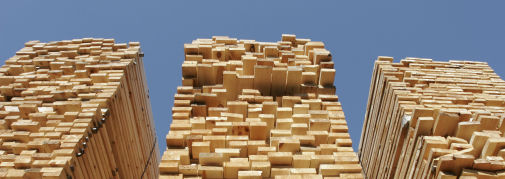 Three large stacks of wood